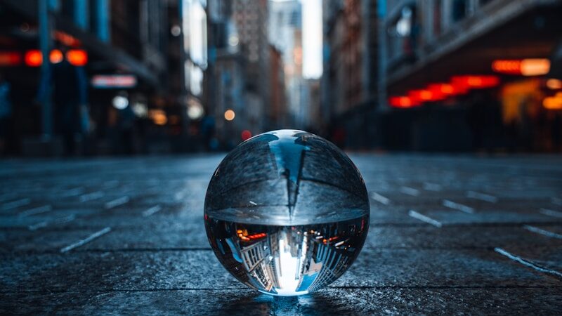 clear glass ball on road during nightime